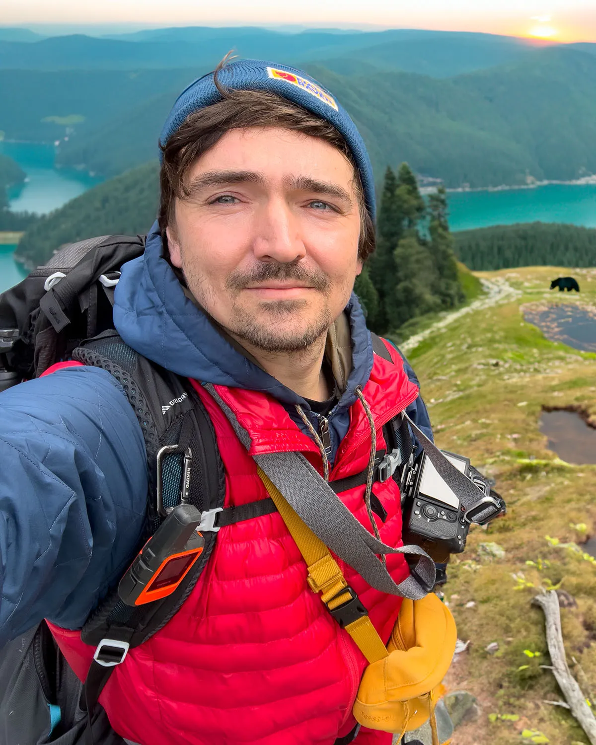 a man taking a selfie on a mountain